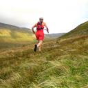Running up the steep grassy spur of Mynydd Du.