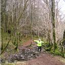 Crossing a small stream on the hillside ascent towards Llyn Geirionydd.