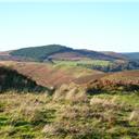 Harehaugh Hill Fort seen through the entrance to Witchy Neuk Hill Fort.